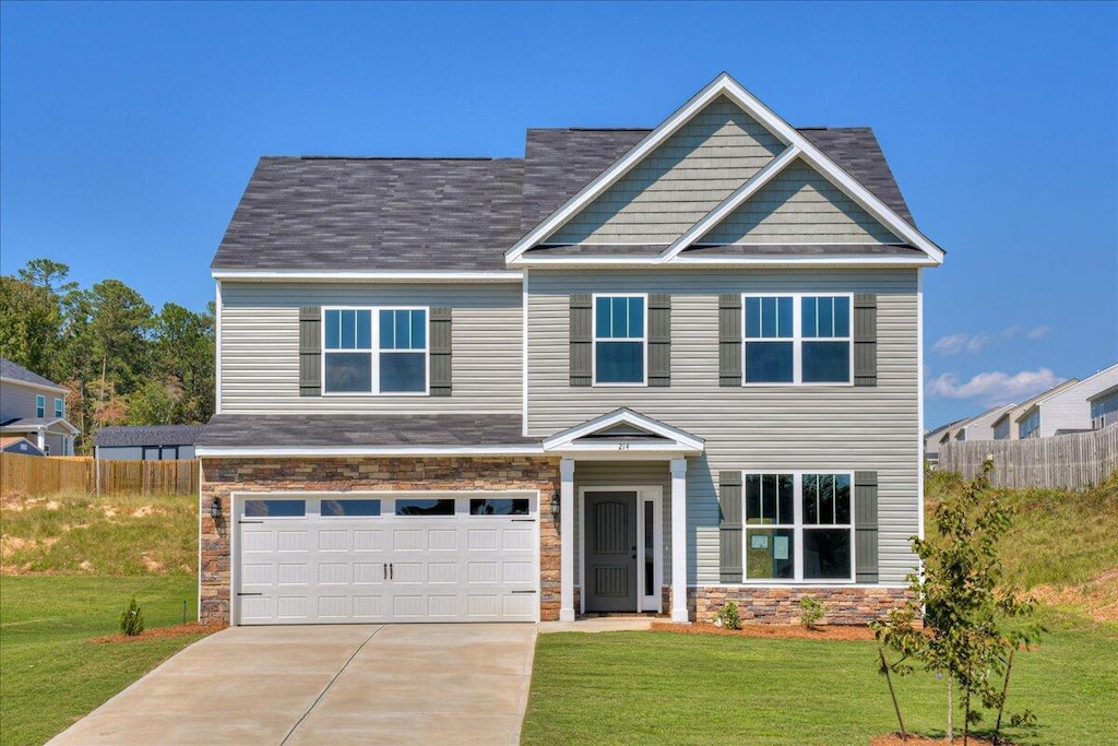 view of front facade with a garage and a front lawn