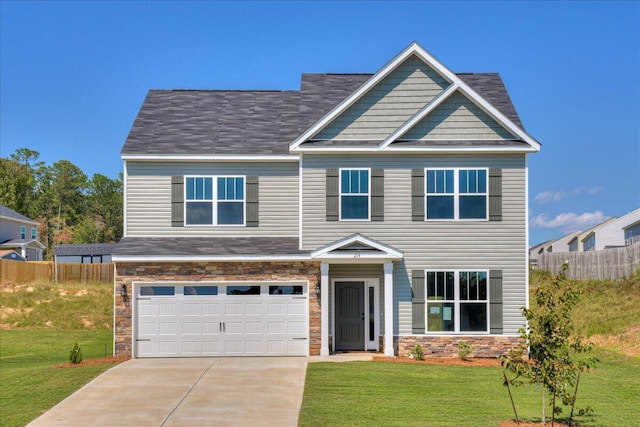 view of front facade with a garage and a front lawn