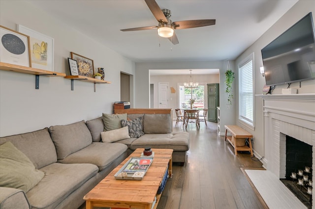 1745 Oak Dr, Augusta, GA 30904 - living area featuring a chandelier, ceiling fan, dark wood-type flooring, and a fireplace
