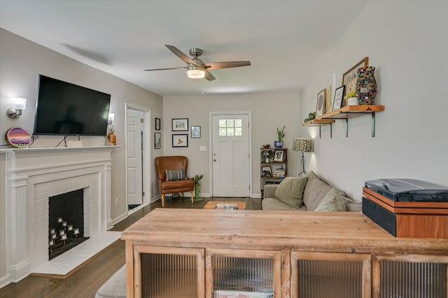 1745 Oak Dr, Augusta, GA 30904 - living room featuring a ceiling fan, a brick fireplace, and dark wood-style flooring