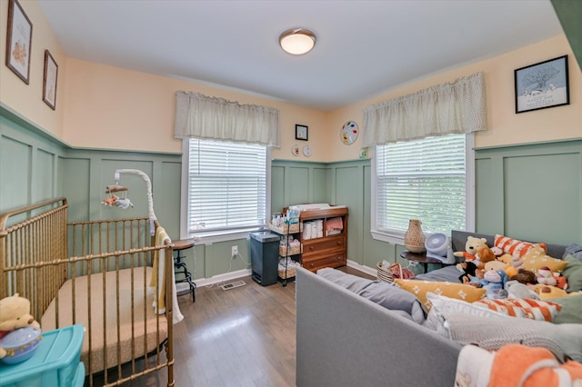1745 Oak Dr, Augusta, GA 30904 - living room with a decorative wall, a wainscoted wall, and wood finished floors