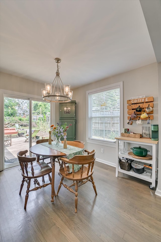 1745 Oak Dr, Augusta, GA 30904 - dining area featuring wood finished floors, a chandelier, and plenty of natural light
