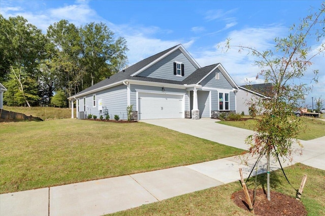 view of front of house featuring a garage and a front lawn