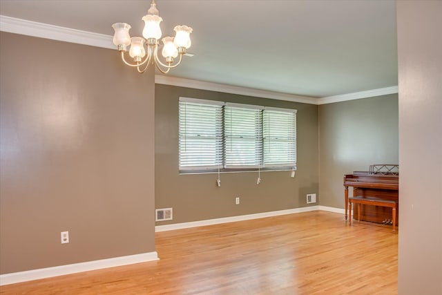 3515 Potomac Dr, Augusta, GA 30906 - unfurnished room with ornamental molding, a chandelier, light wood finished floors, and baseboards