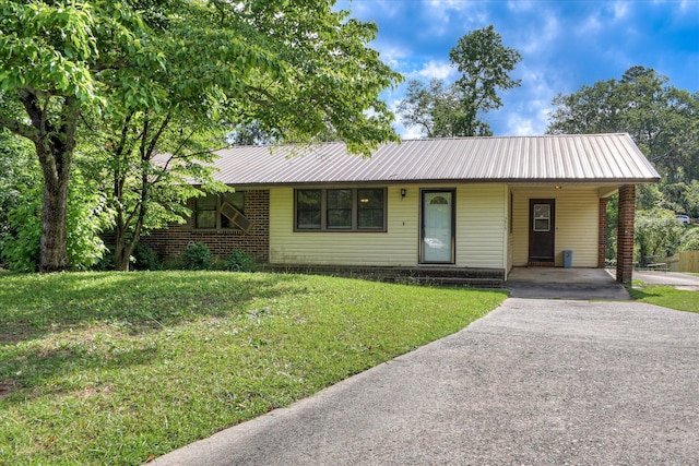 3515 Potomac Dr, Augusta, GA 30906 - single story home featuring asphalt driveway, a front yard, an attached carport, and metal roof