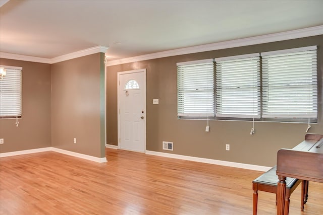 3515 Potomac Dr, Augusta, GA 30906 - foyer featuring light wood-type flooring, ornamental molding, baseboards, and a chandelier