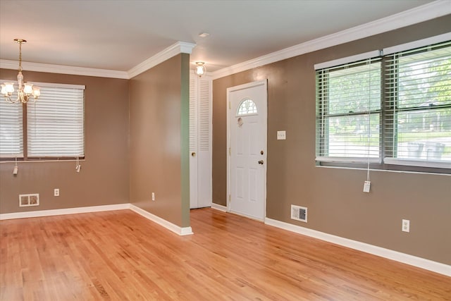 3515 Potomac Dr, Augusta, GA 30906 - entrance foyer featuring ornamental molding, light wood-type flooring, a chandelier, and baseboards