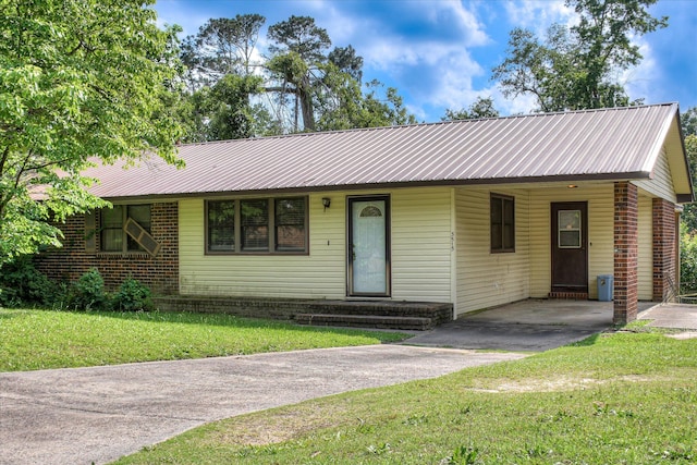 3515 Potomac Dr, Augusta, GA 30906 - ranch-style house featuring driveway, a front lawn, metal roof, and a carport