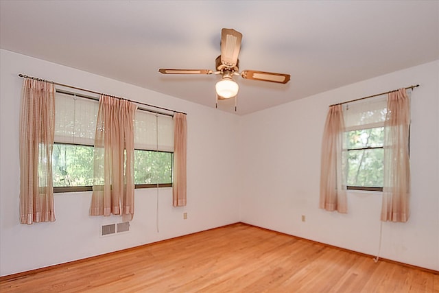 3515 Potomac Dr, Augusta, GA 30906 - empty room with plenty of natural light, wood finished floors, and a ceiling fan