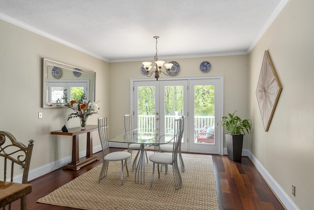 403 Ascot Dr, Aiken, SC 29803 - dining space with dark wood-type flooring, ornamental molding, baseboards, and a chandelier