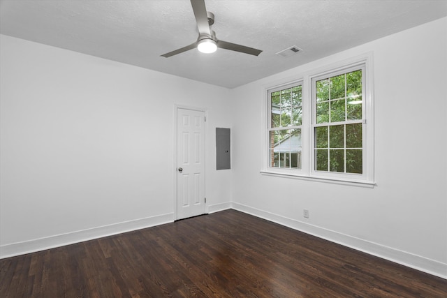 unfurnished room with a textured ceiling, dark hardwood / wood-style flooring, and ceiling fan