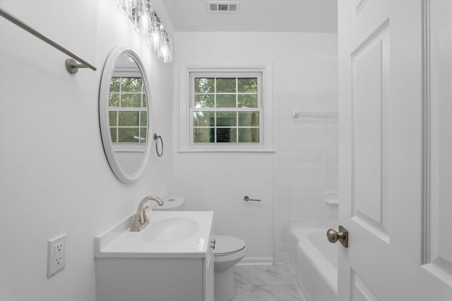 full bathroom featuring vanity, bathtub / shower combination, and toilet