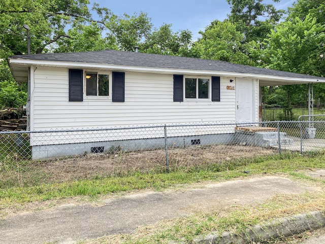 view of front of home featuring crawl space and roof with shingles