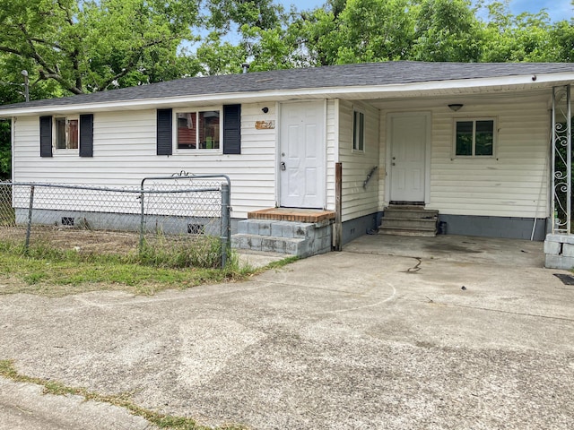 view of front of house featuring entry steps, crawl space, fence, and a shingled roof