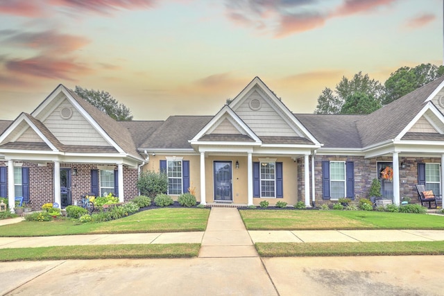 craftsman-style house with a lawn