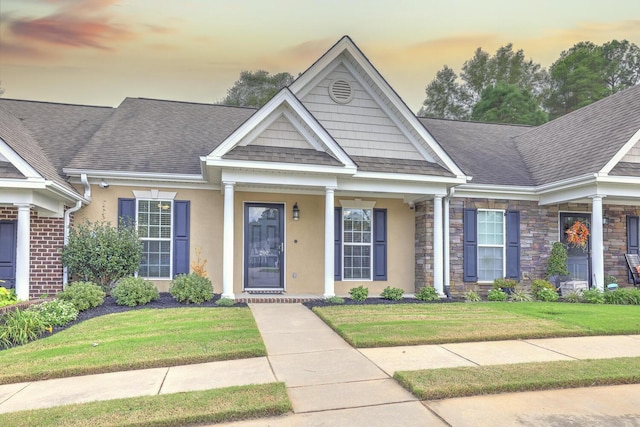 view of front of property with a yard