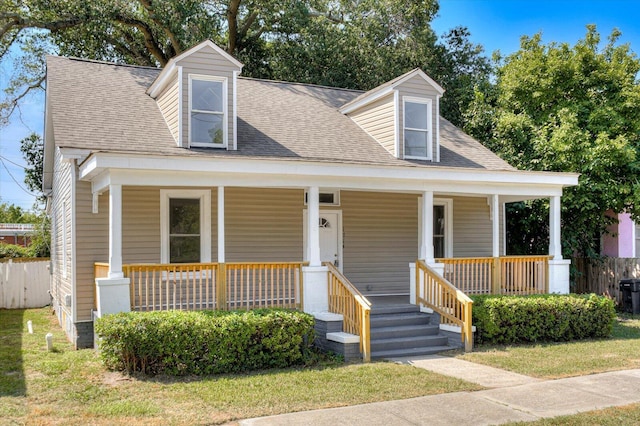 cape cod home with a porch