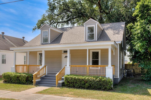 new england style home with a porch