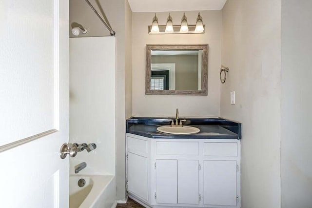 bathroom featuring vanity and washtub / shower combination