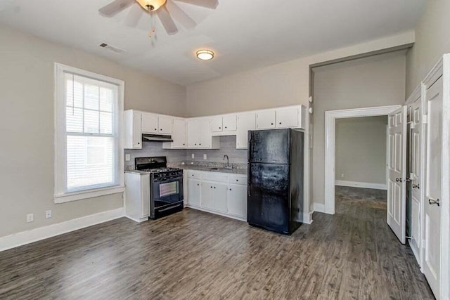 kitchen featuring white cabinets, sink, and black appliances