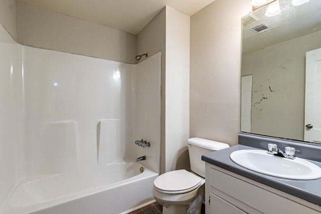 full bathroom featuring vanity, shower / bath combination, and toilet