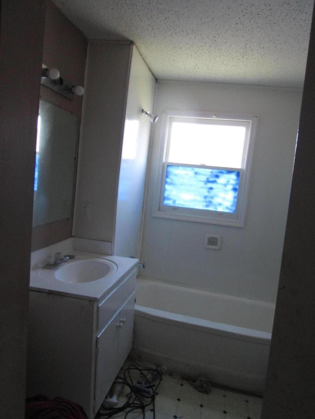 bathroom with shower / bathing tub combination and vanity