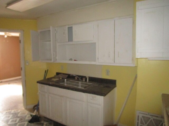 kitchen with white cabinetry and sink