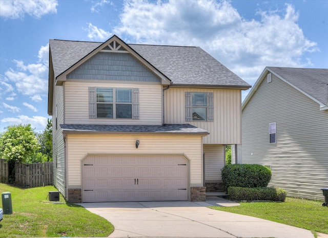 3374 Grove Landing Cir, Grovetown, GA 30813 - view of front facade featuring concrete driveway, an attached garage, a shingled roof, and board and batten siding