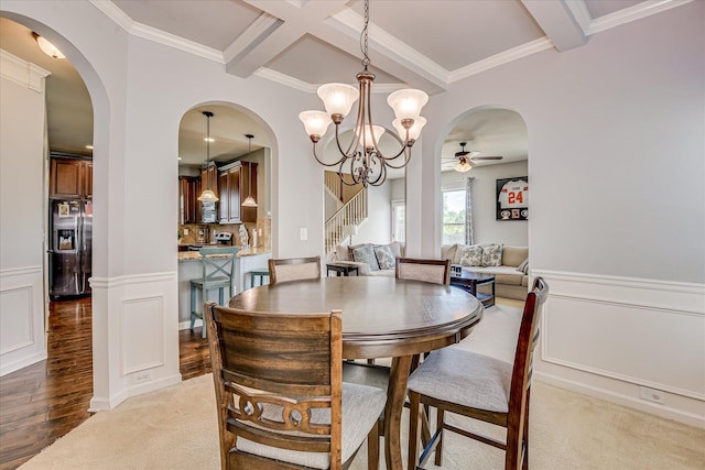 3374 Grove Landing Cir, Grovetown, GA 30813 - dining area featuring a ceiling fan, beam ceiling, arched walkways, stairs, and a chandelier