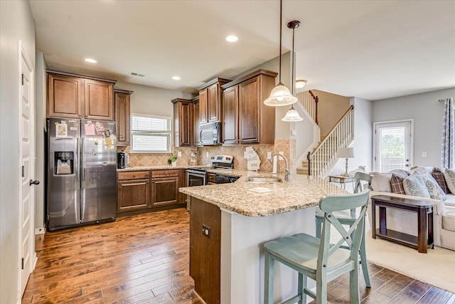 3374 Grove Landing Cir, Grovetown, GA 30813 - kitchen with stainless steel appliances, a sink, a peninsula, healthy amount of natural light, and recessed lighting