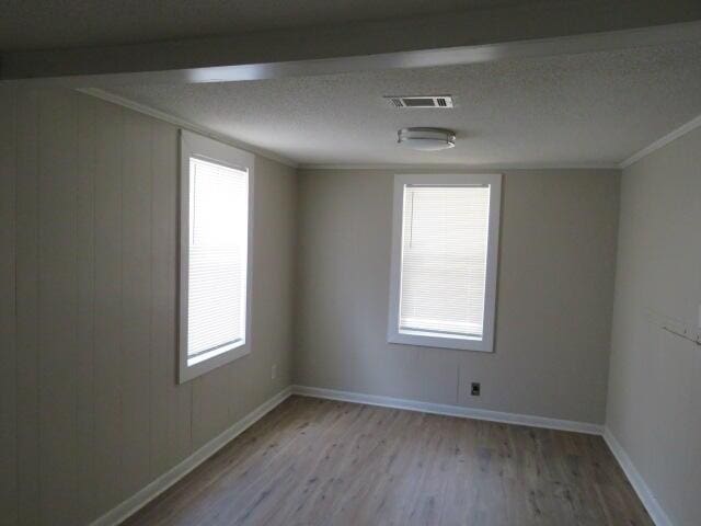 2810 Anne St, Augusta, GA 30906 - spare room with wood finished floors, healthy amount of natural light, and ornamental molding