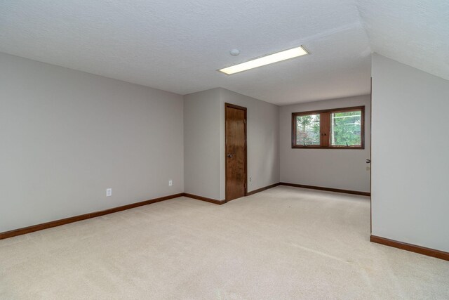 705 Woodgate Ct, Augusta, GA 30909 - spare room featuring light carpet and lofted ceiling