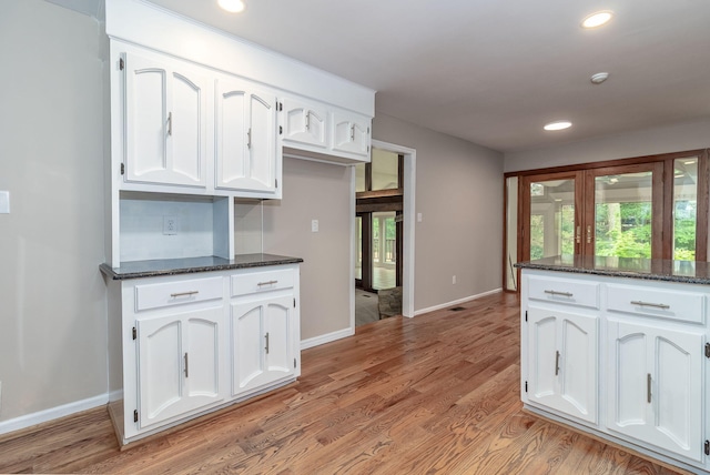 705 Woodgate Ct, Augusta, GA 30909 - kitchen featuring white cabinetry, dark stone counters, light wood-style floors, and recessed lighting