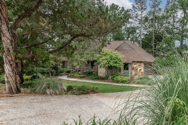 705 Woodgate Ct, Augusta, GA 30909 - obstructed view of property with stone siding and roof with shingles