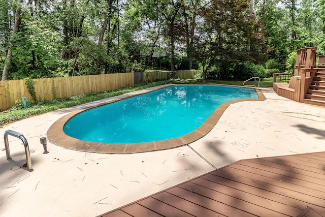 705 Woodgate Ct, Augusta, GA 30909 - view of pool featuring a fenced backyard, a patio area, view of wooded area, and a deck