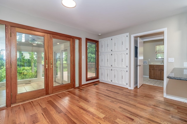705 Woodgate Ct, Augusta, GA 30909 - doorway with light wood-style flooring and baseboards
