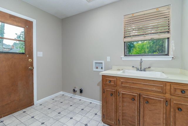 705 Woodgate Ct, Augusta, GA 30909 - laundry area with washer hookup, plenty of natural light, and light tile patterned floors