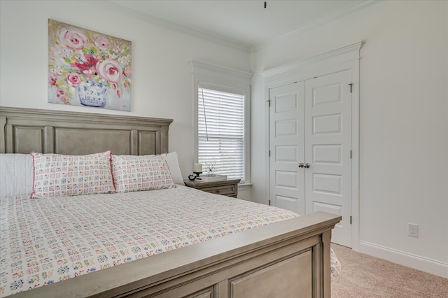 508 Oakley Grv Cir, Evans, GA 30809 - bedroom featuring a closet, light colored carpet, and crown molding