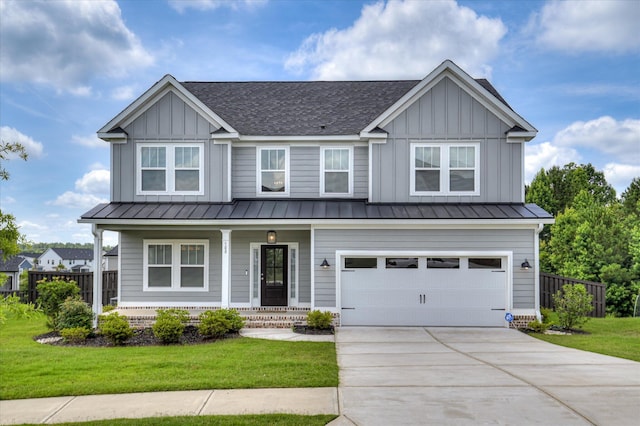 508 Oakley Grv Cir, Evans, GA 30809 - view of front of property with board and batten siding, covered porch, driveway, and a standing seam roof