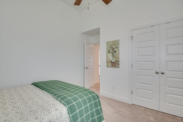 508 Oakley Grv Cir, Evans, GA 30809 - bedroom with light colored carpet, a closet, a towering ceiling, and a ceiling fan