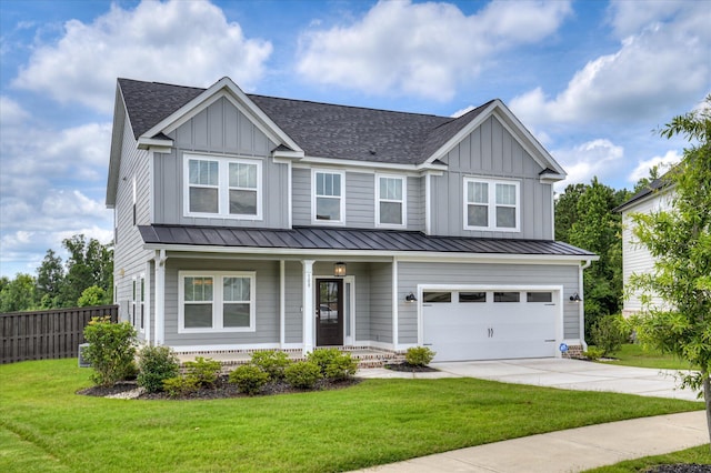 508 Oakley Grv Cir, Evans, GA 30809 - view of front of property featuring board and batten siding, a porch, driveway, a standing seam roof, and a garage