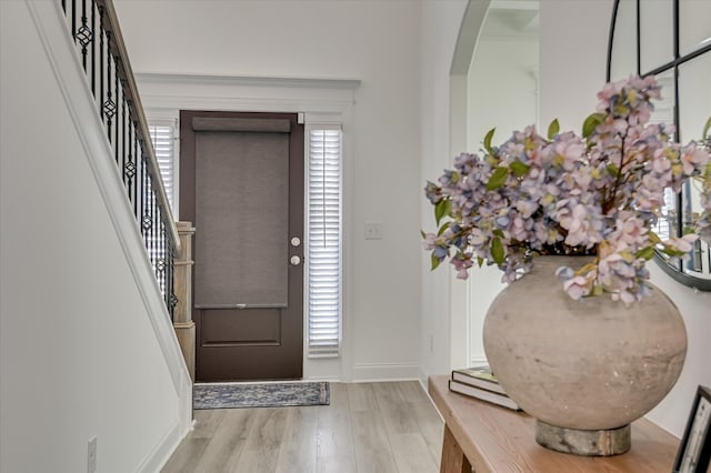 508 Oakley Grv Cir, Evans, GA 30809 - entryway with wood finished floors, arched walkways, and stairs