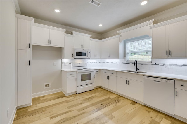 6135 Mottled Duck Dr, North Augusta, SC 29860 - kitchen with white appliances, a sink, light countertops, decorative backsplash, and recessed lighting