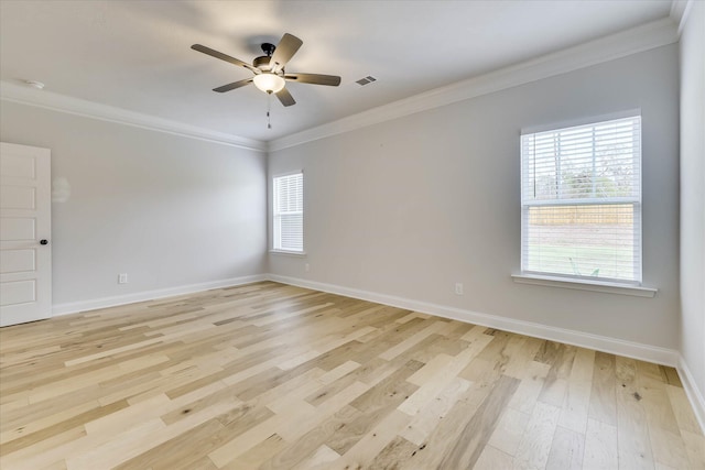 6135 Mottled Duck Dr, North Augusta, SC 29860 - spare room with crown molding, light wood-style flooring, ceiling fan, and baseboards