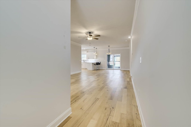 6135 Mottled Duck Dr, North Augusta, SC 29860 - unfurnished living room with crown molding, ceiling fan, baseboards, and light wood-style flooring