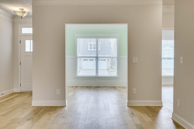 6135 Mottled Duck Dr, North Augusta, SC 29860 - unfurnished room featuring ornamental molding, light wood-style floors, a chandelier, and baseboards