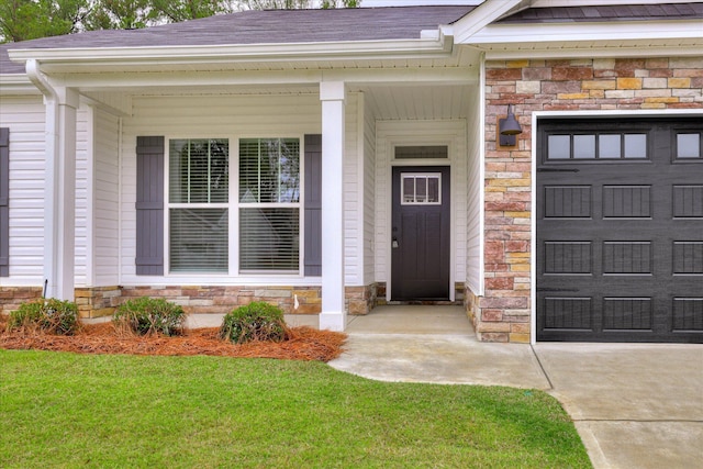6135 Mottled Duck Dr, North Augusta, SC 29860 - property entrance featuring stone siding, roof with shingles, a garage, driveway, and a lawn