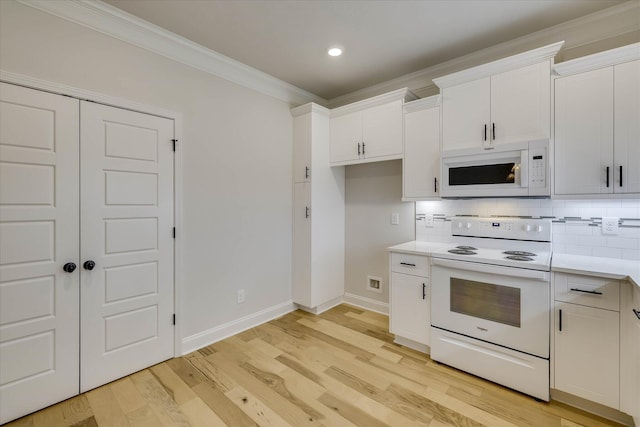 6135 Mottled Duck Dr, North Augusta, SC 29860 - kitchen with white appliances, ornamental molding, light countertops, tasteful backsplash, and white cabinetry