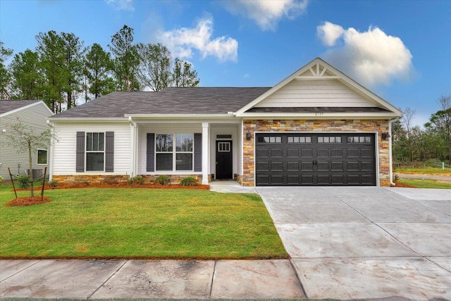 6135 Mottled Duck Dr, North Augusta, SC 29860 - view of front of property with stone siding, driveway, a front lawn, and an attached garage
