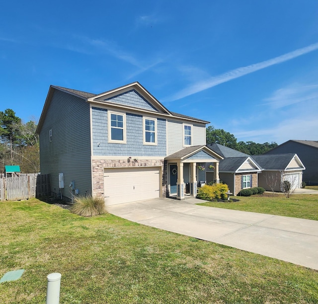 view of front of home with a front yard, fence, stone siding, and driveway